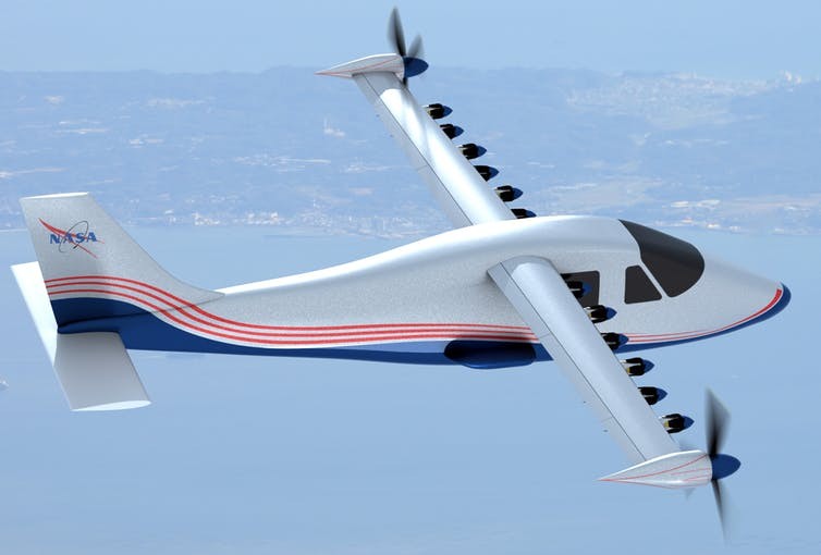 This artist’s concept of NASA’s experimental electric plane design shows 14 motors along the wings.  NASA