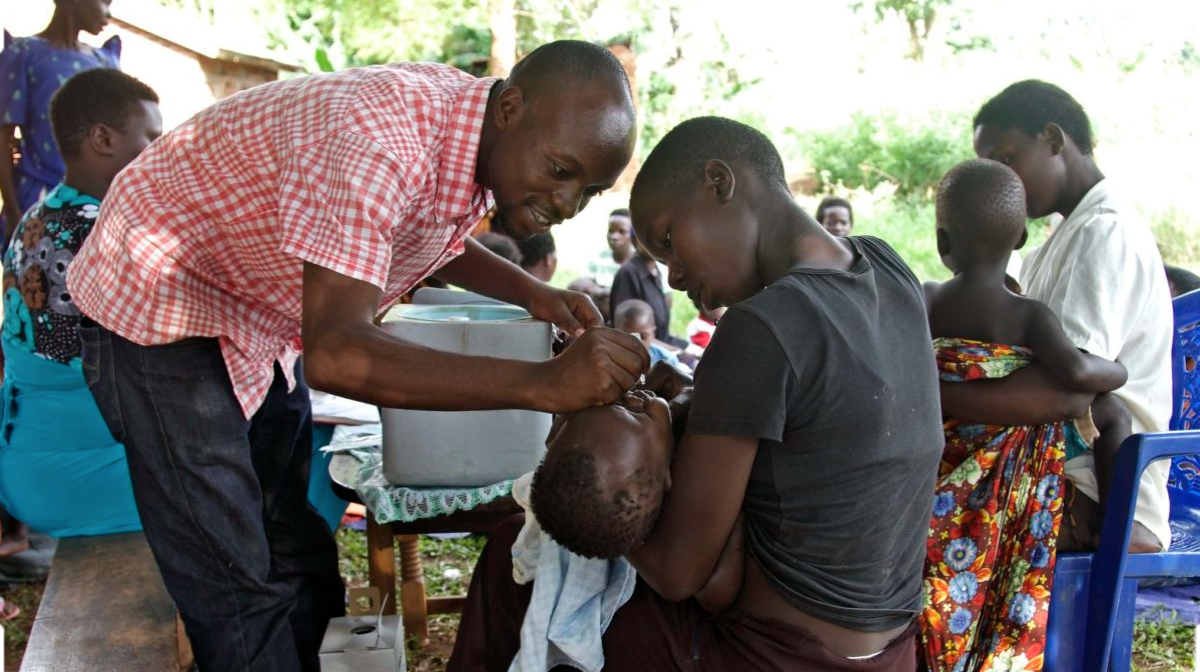 Women members of a nutrition education center in Kamuli, Uganda receive polio immunizations for their children. Credit: Brandie Nonnecke